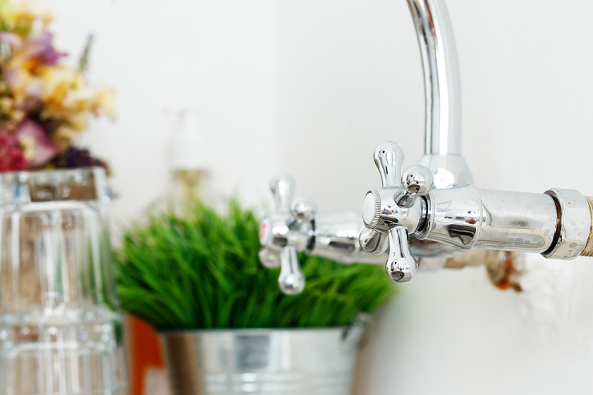 Kitchen, housework. Shiny tap in the corner